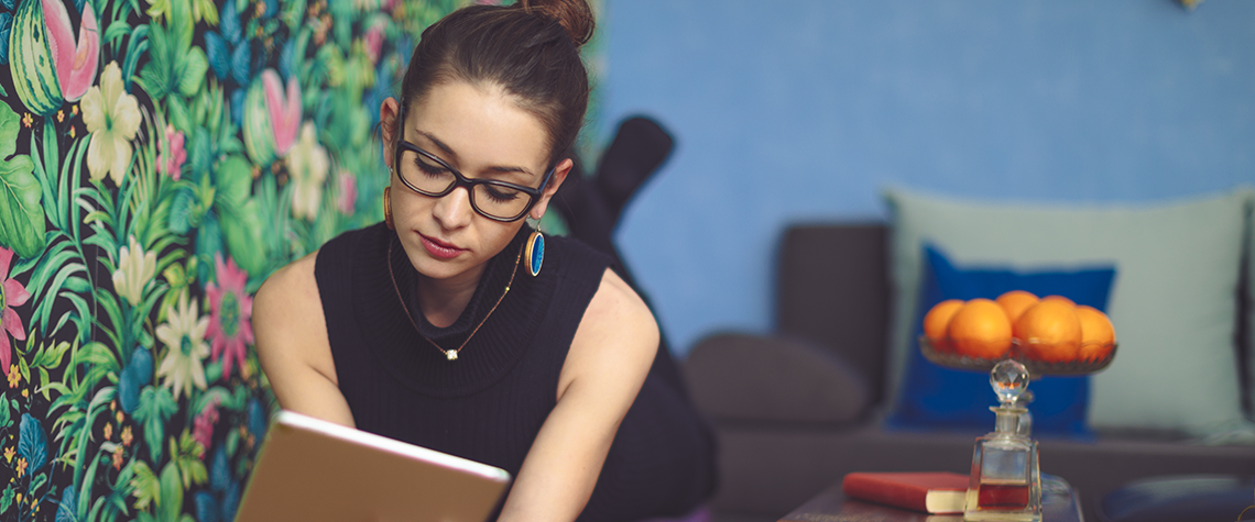 girl relaxed writing in notebook