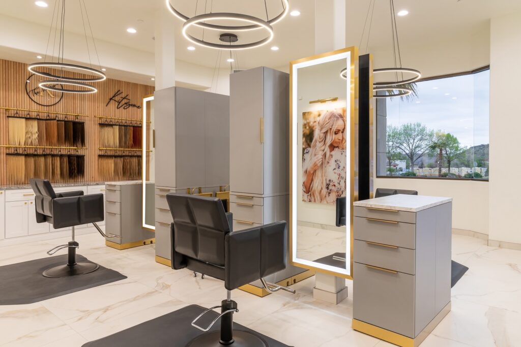 modern and bright salon with lighting over each chair