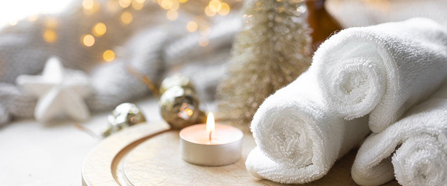 spa towels next to christmas decorations