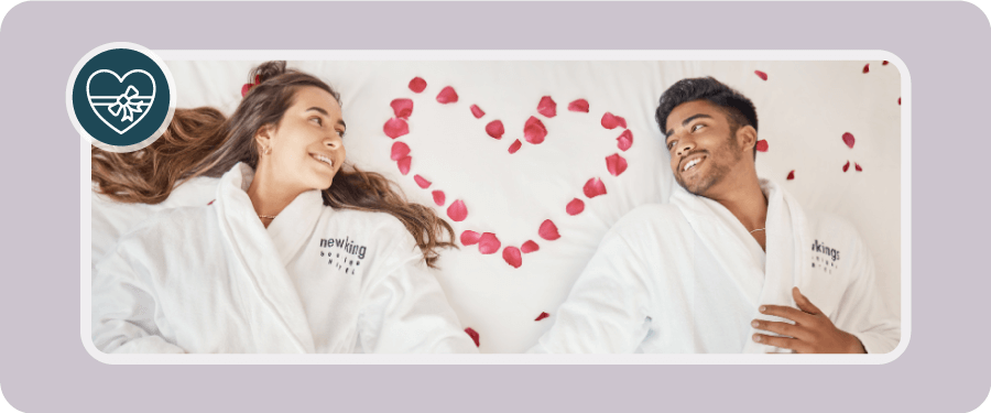 valentines day salon and spa promotion ideas - a couple in spa robes surrounded by roses