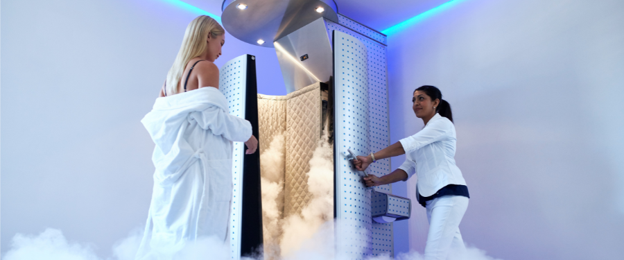 Spa trends - woman going into cryotherapy chamber at a spa