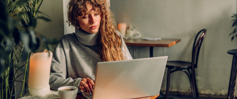 Woman setting spa and salon goals on laptop