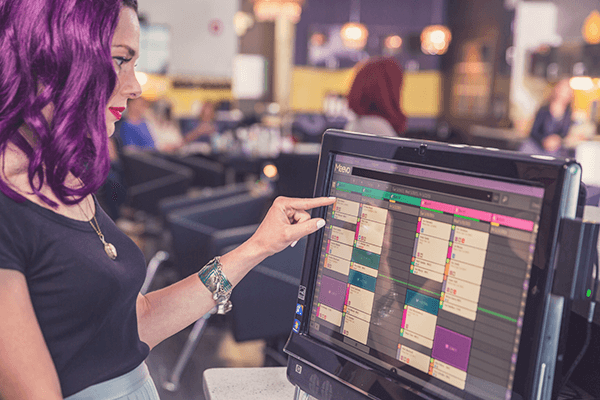 Front desk using Meevo salon and spa appointment book