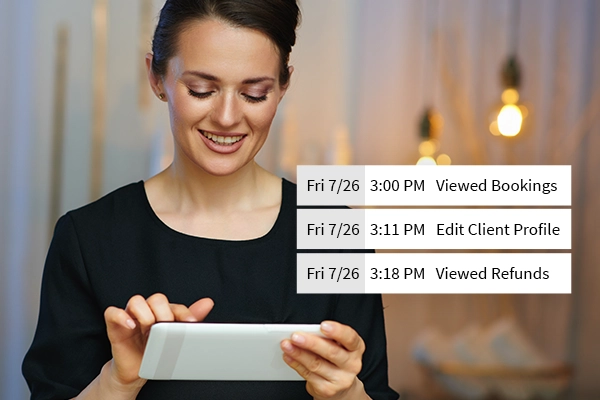 Female esthetician viewing Meevo Activity Log on tablet